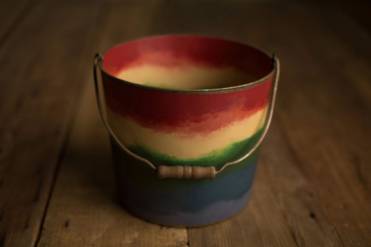 A carved watermelon rind turned into a decorative basket sits on a rustic wooden surface.