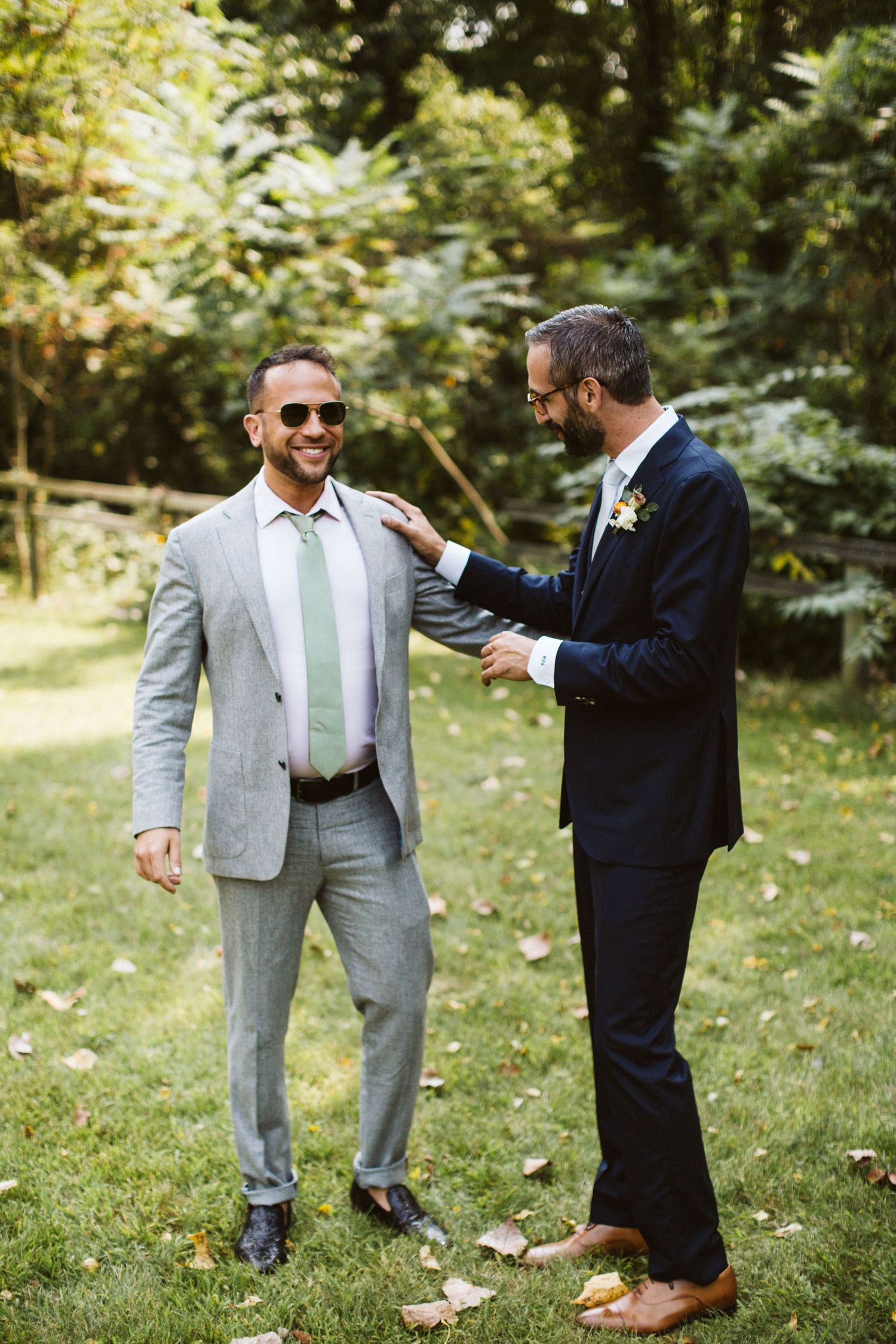 Candid wedding photo sequence showing playful interactions between two people on a grassy lawn.