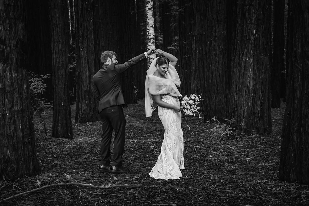 Black and white photos capture silhouettes of a bride walking through a dark forest setting.