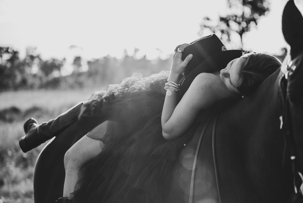 Black and white photo collage showing couples kissing in romantic outdoor settings and poses.