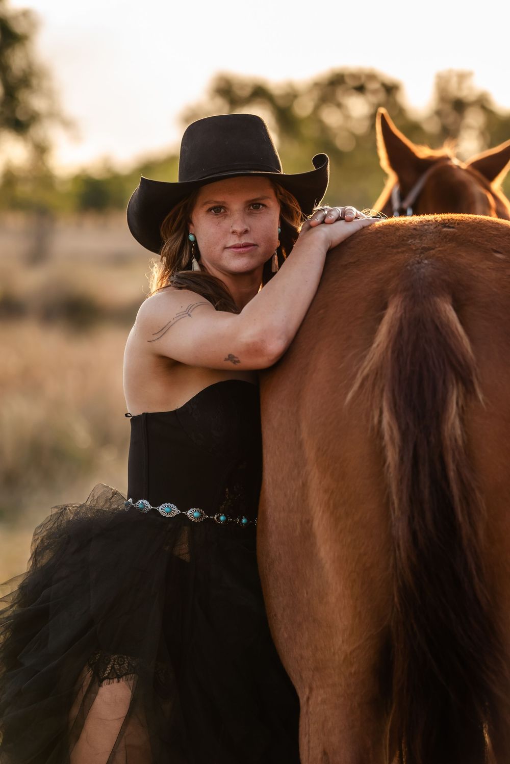 Three cropped images show someone in a black hat tenderly hugging a brown horse's neck during sunset outdoors.