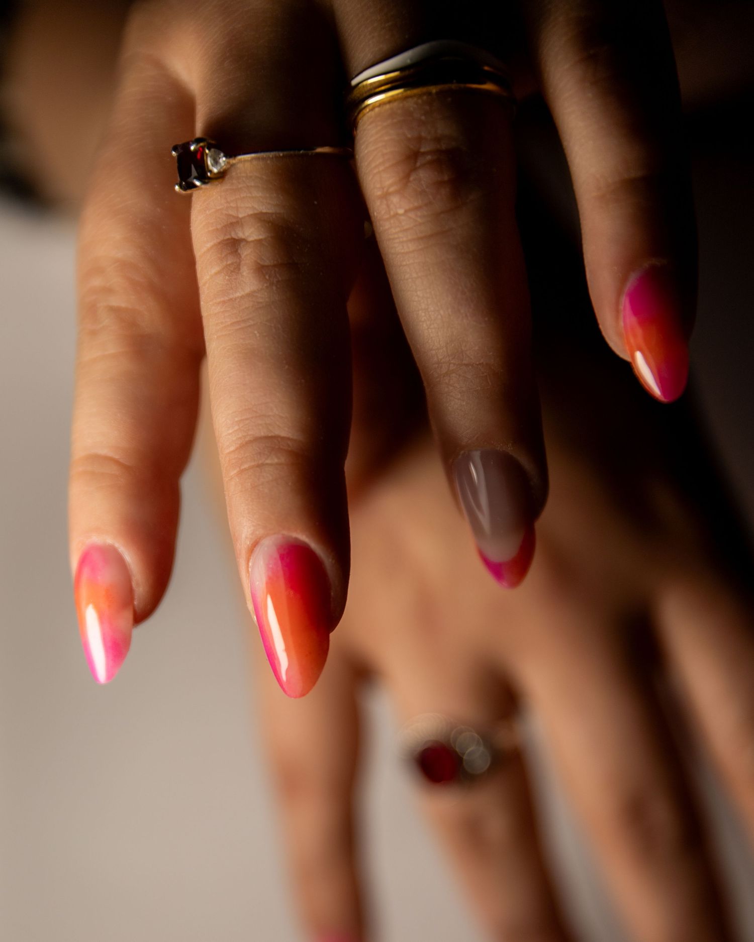 Elegant floral and striped nail art design in light pink and white with delicate details on manicured nails.