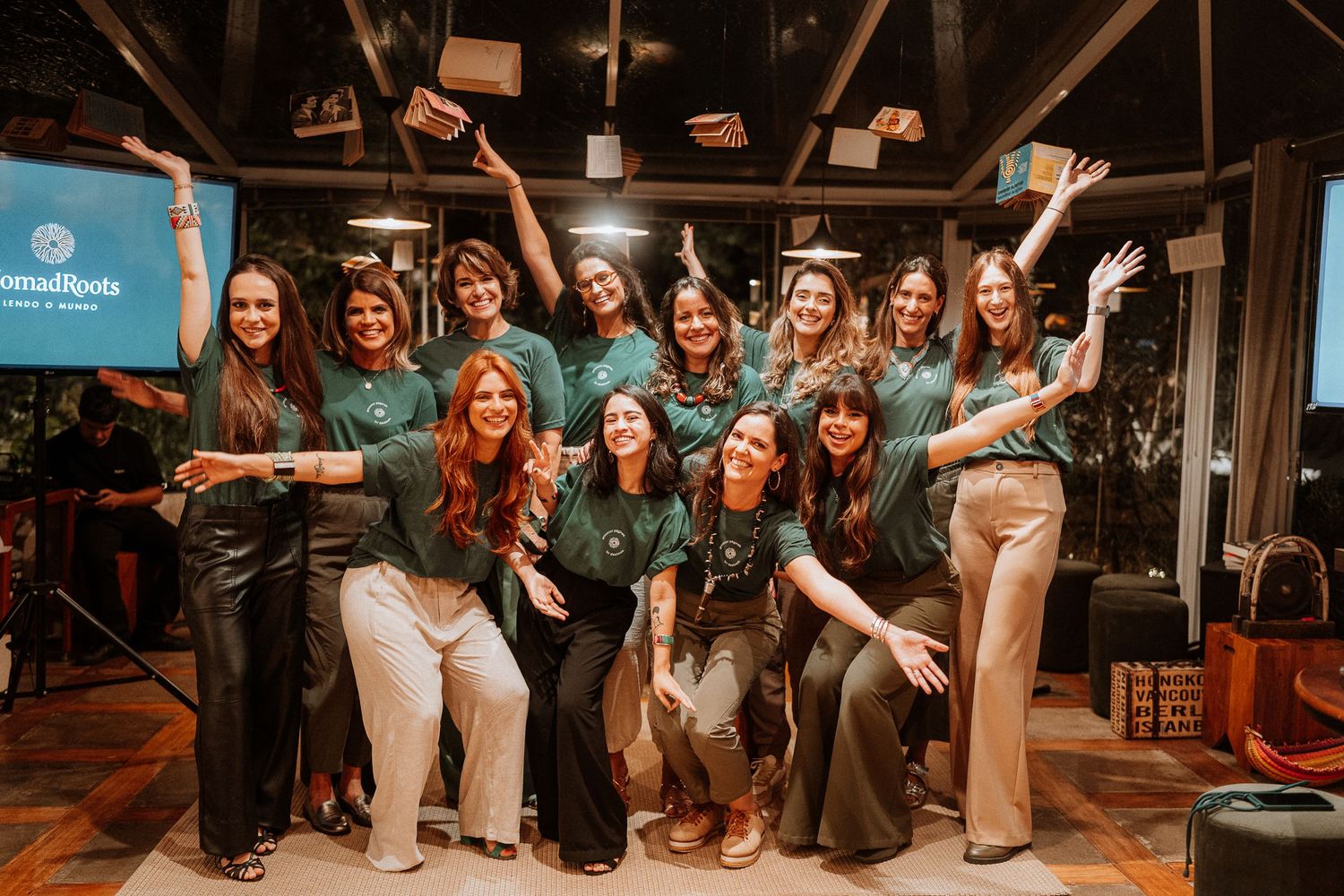 Group posed together in casual setting with matching outfits.