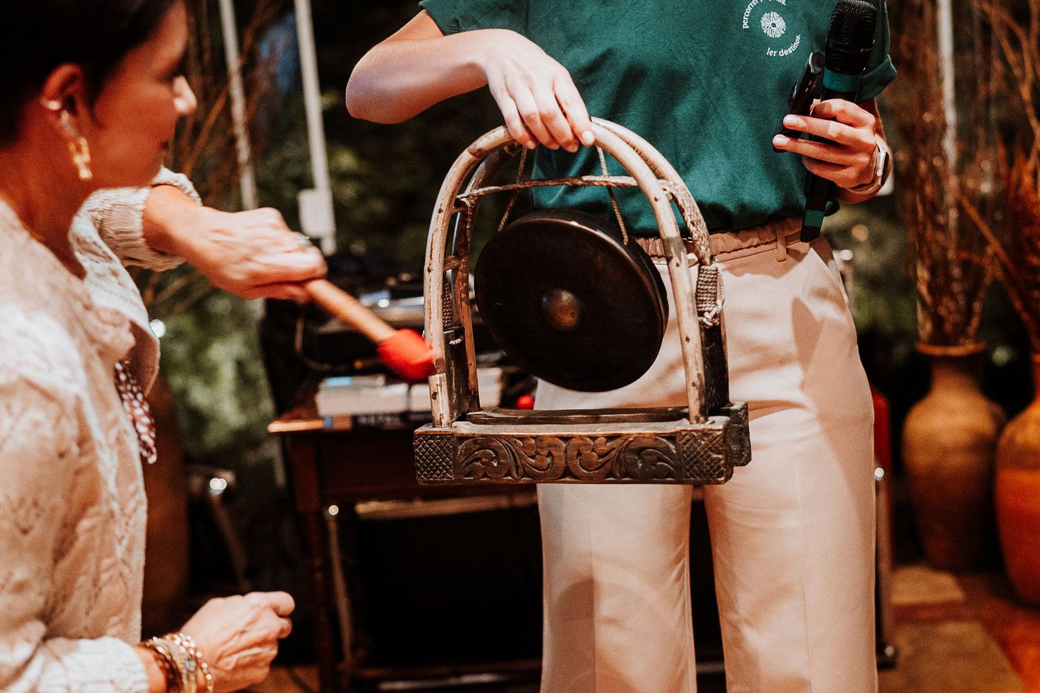Steam rising from an antique coffee brewing machine being operated at an event.