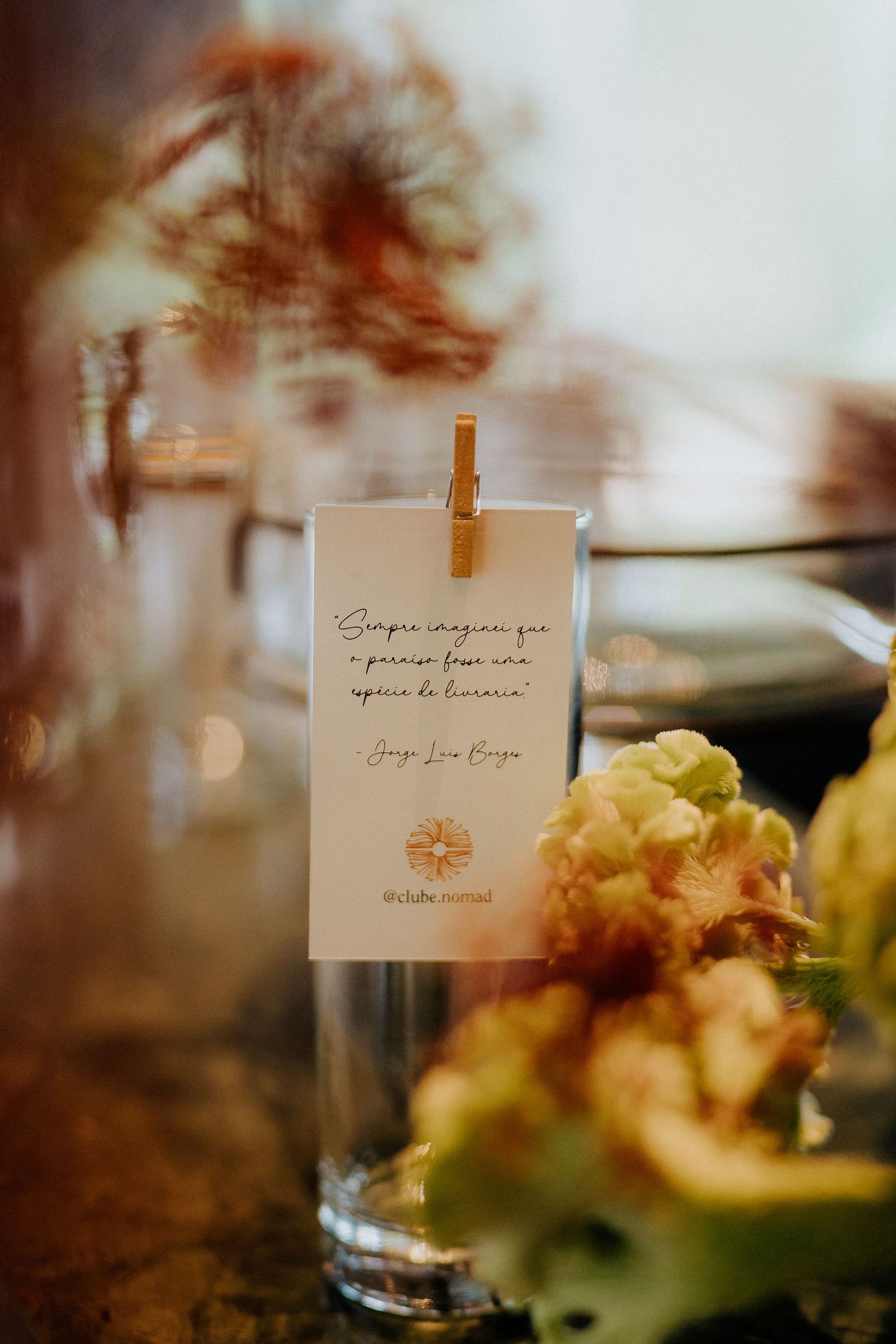 Small handwritten cards displayed with clothespins against a soft-focus background.