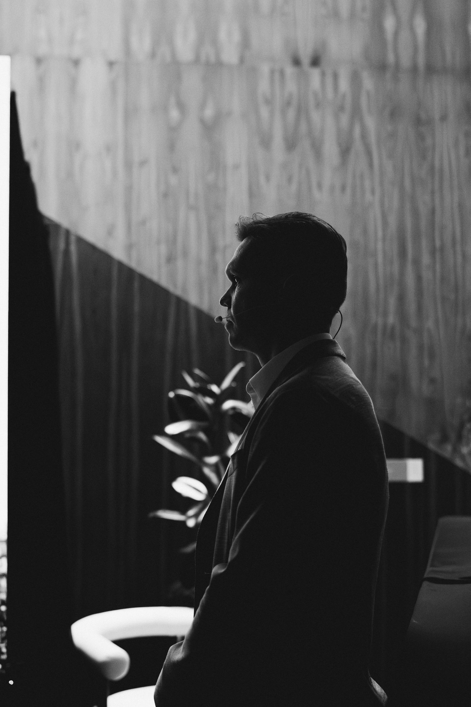 Silhouette of person in dark setting with dramatic lighting.