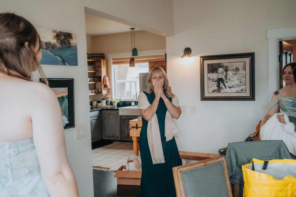 A couple getting ready together in a bright modern home interior with soft natural lighting.
