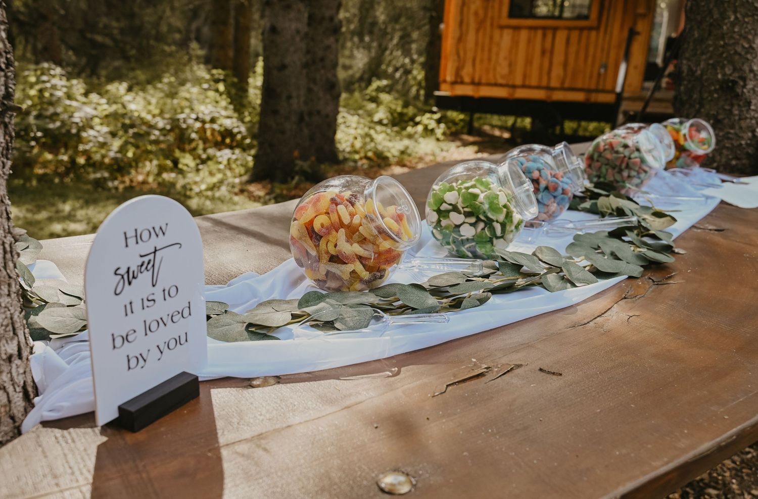Elegant wedding reception table setup with place cards and floral arrangements.