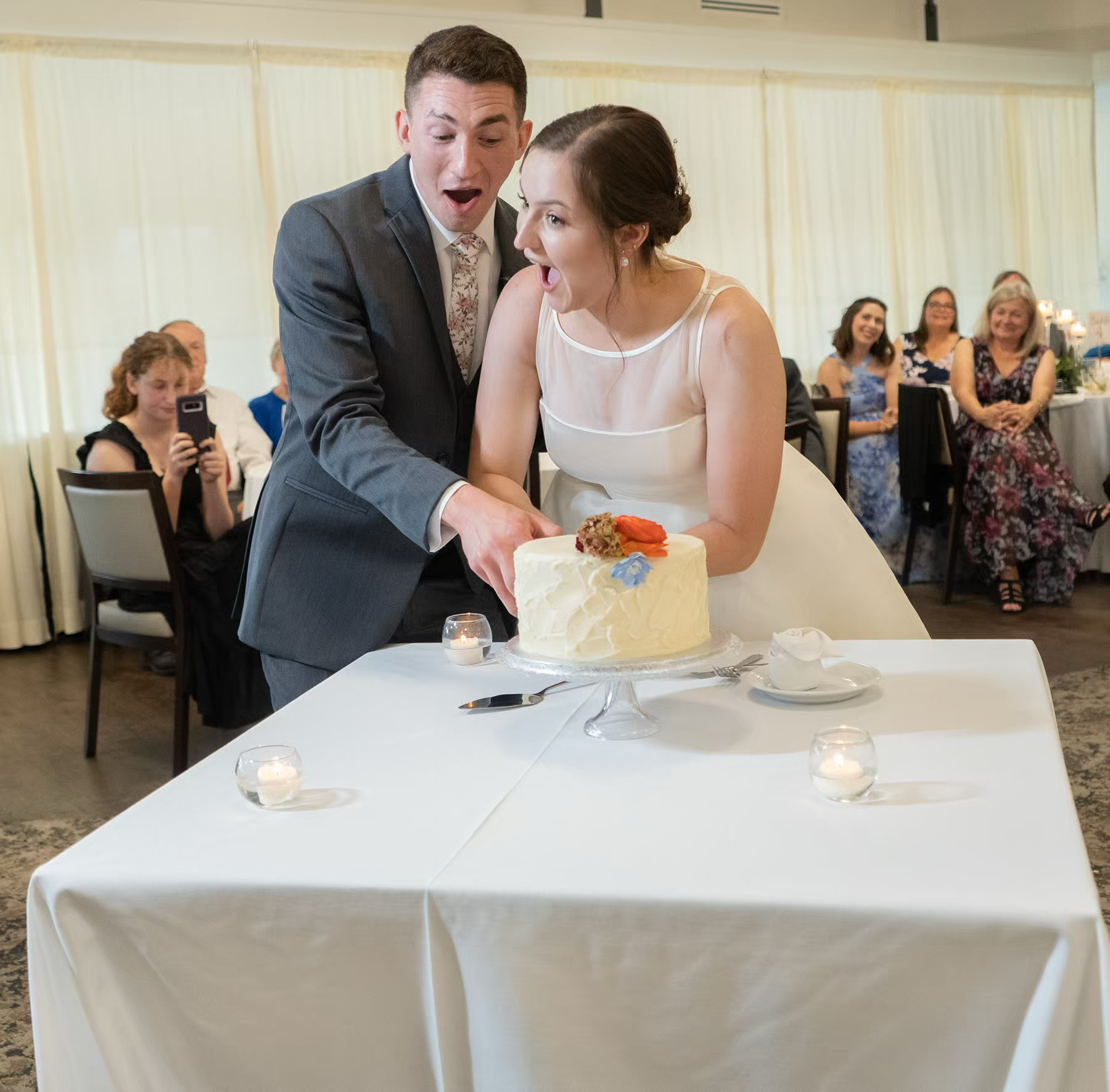 A newly weds cut cake in Nationwide Conference Center