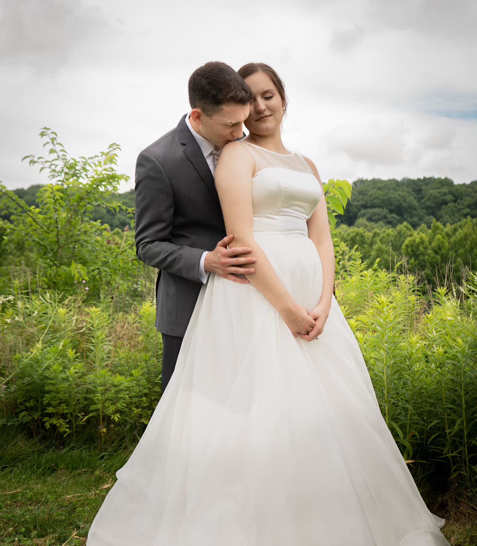 Romantic wedding couple embraces inNationwide Conference Center