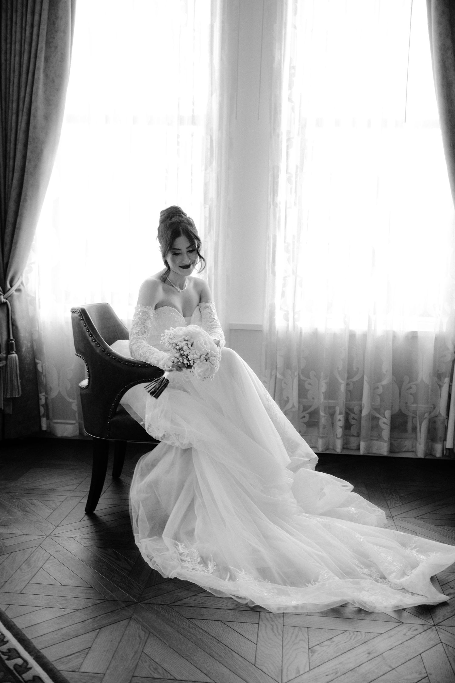 A series of black and white photos showing a wedding dress flowing gracefully across a hardwood floor in an elegant room.