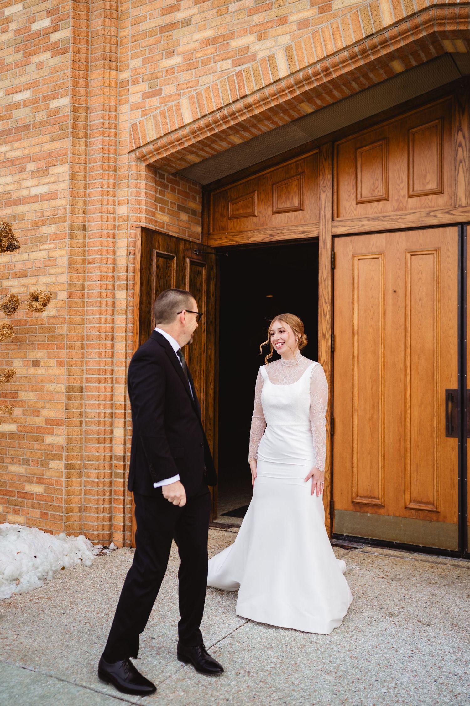 A series of candid wedding photos showing a couple interacting in front of wooden doors at a brick building.