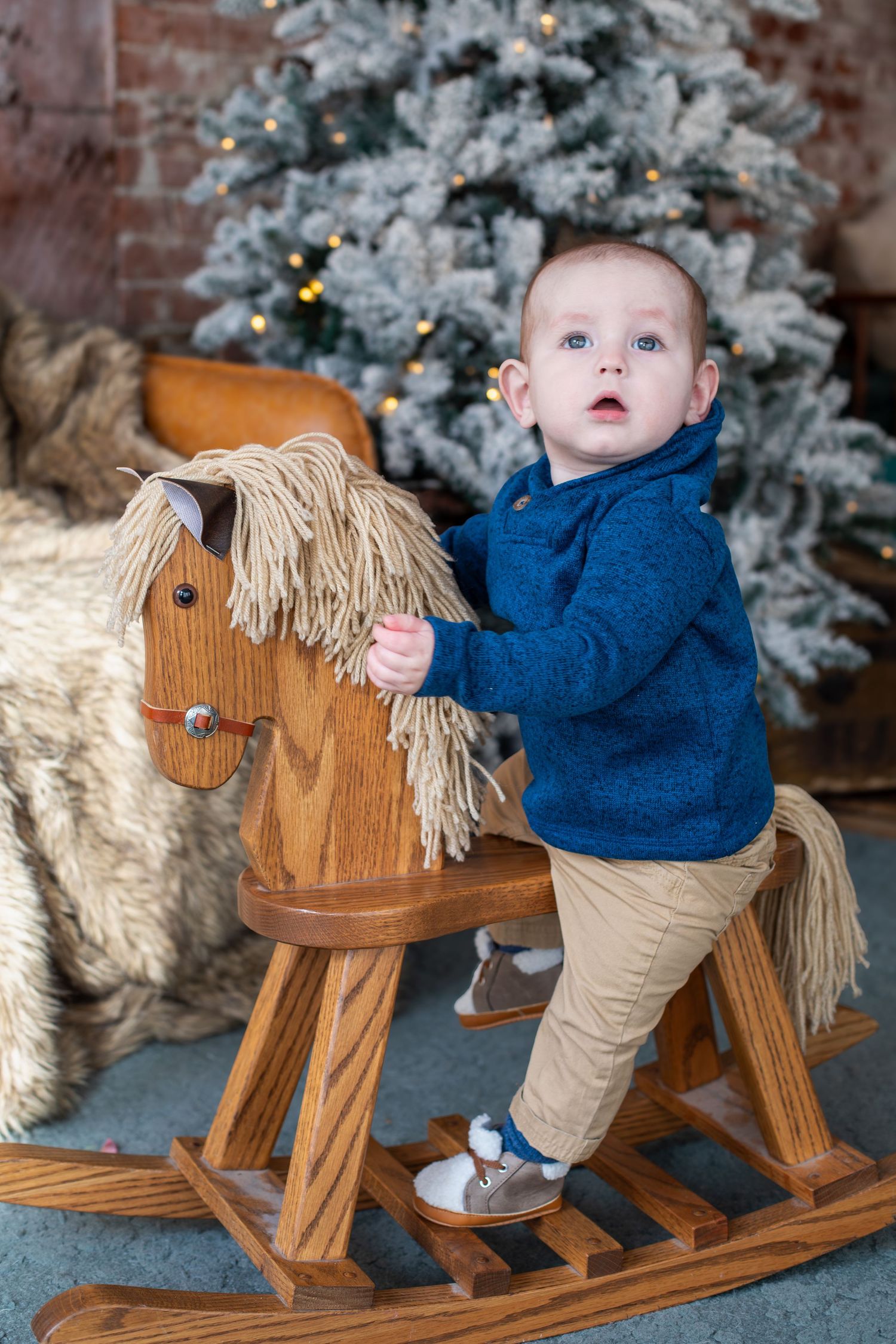11-month-old baby boy sitting for Cincinnati family photos, showing his sweet personality and connection with mom.
