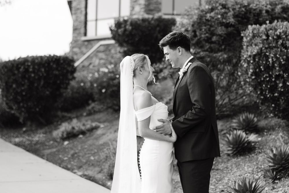 A romantic black and white wedding photo collage showing intimate moments between a couple in an outdoor setting.
