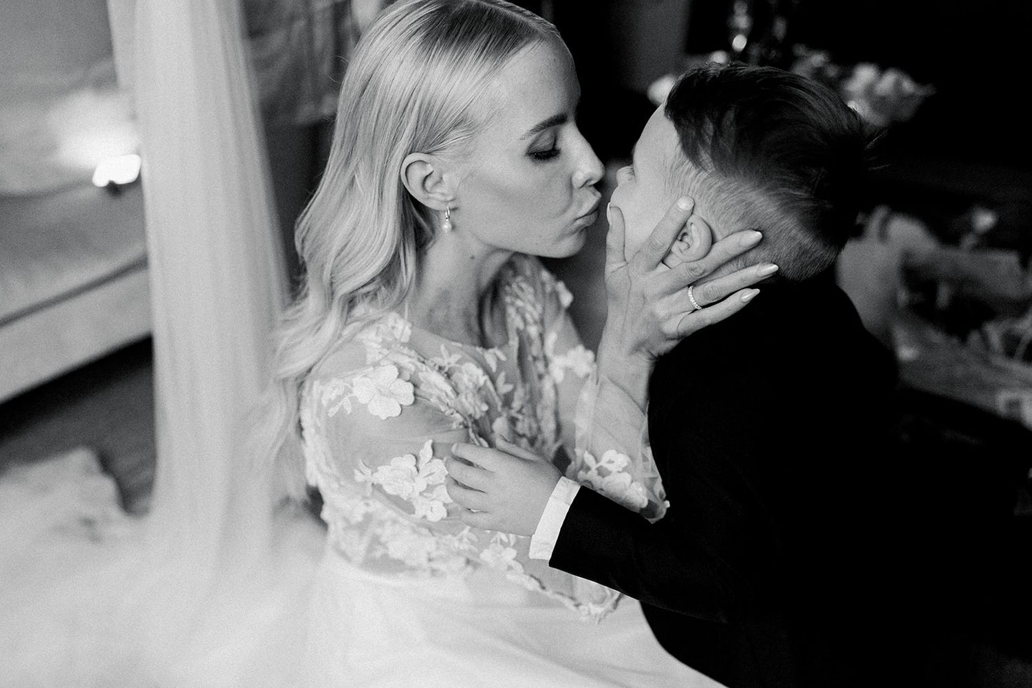 A romantic black and white photo series showing tender moments between a couple on their wedding day.