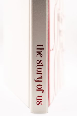 White cylindrical bottles arranged in a row with minimalist text labeling against a light background.