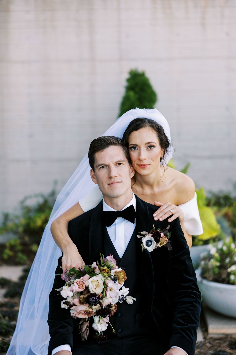 A series of romantic wedding portraits showing a couple in traditional formal attire with delicate floral bouquets.