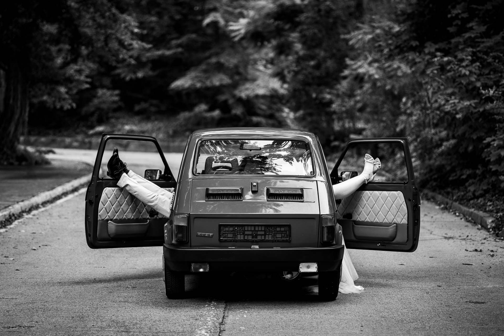 Black and white wedding photos featuring a vintage teal automobile.