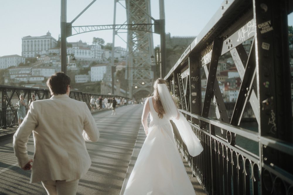 porto elopement couple walking on bridge