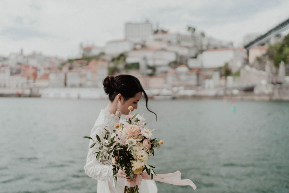 porto elopement bride with bouquet by river