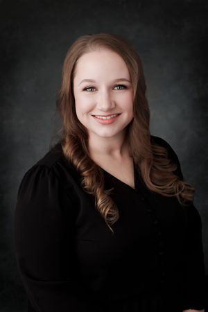 Professional portrait series against dark background showing different poses and expressions in dramatic lighting.
