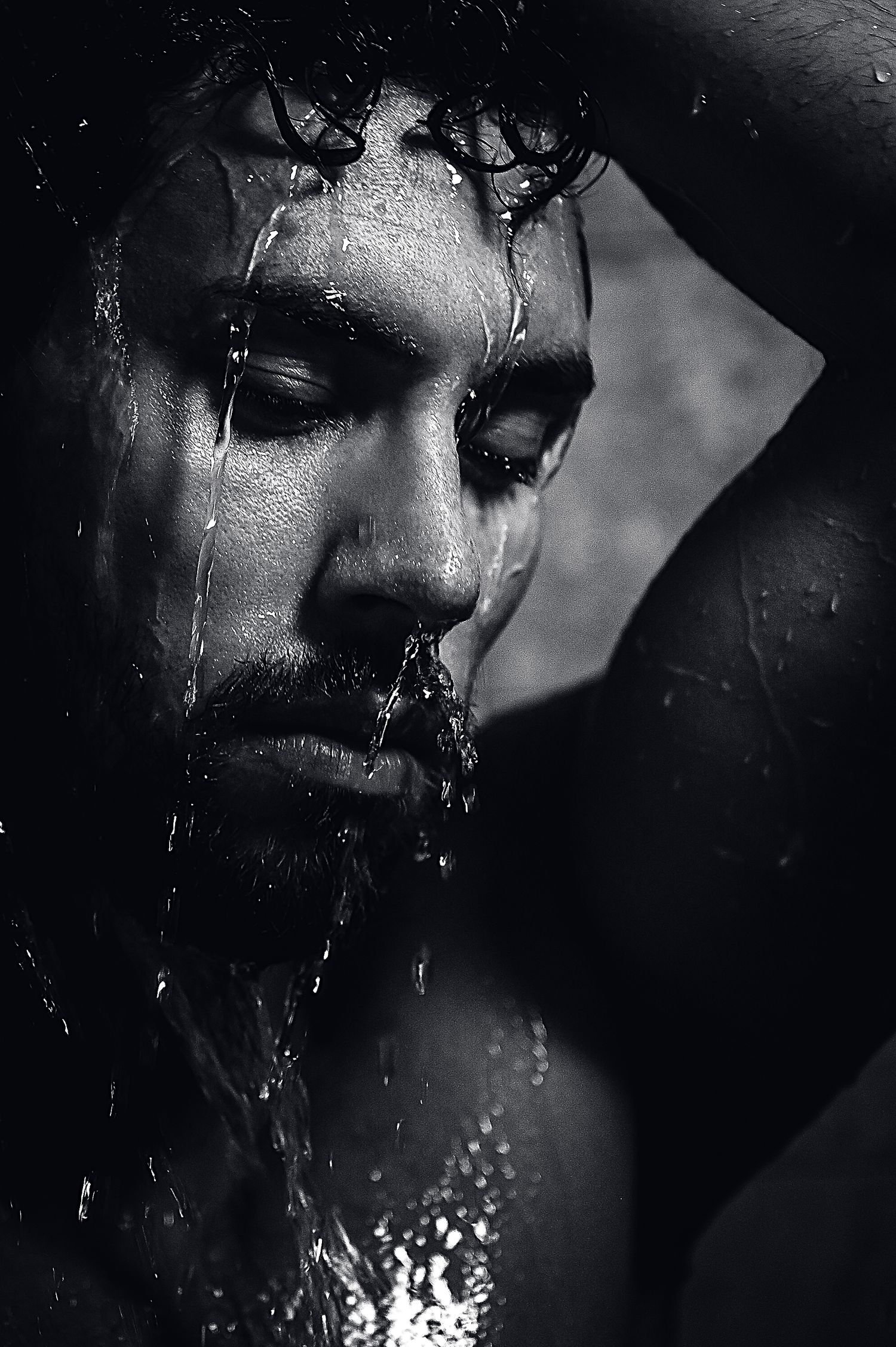Utah male boudoir photography by Carl James Photography in Salt Lake City, Black and white male posing in shower and water running down face