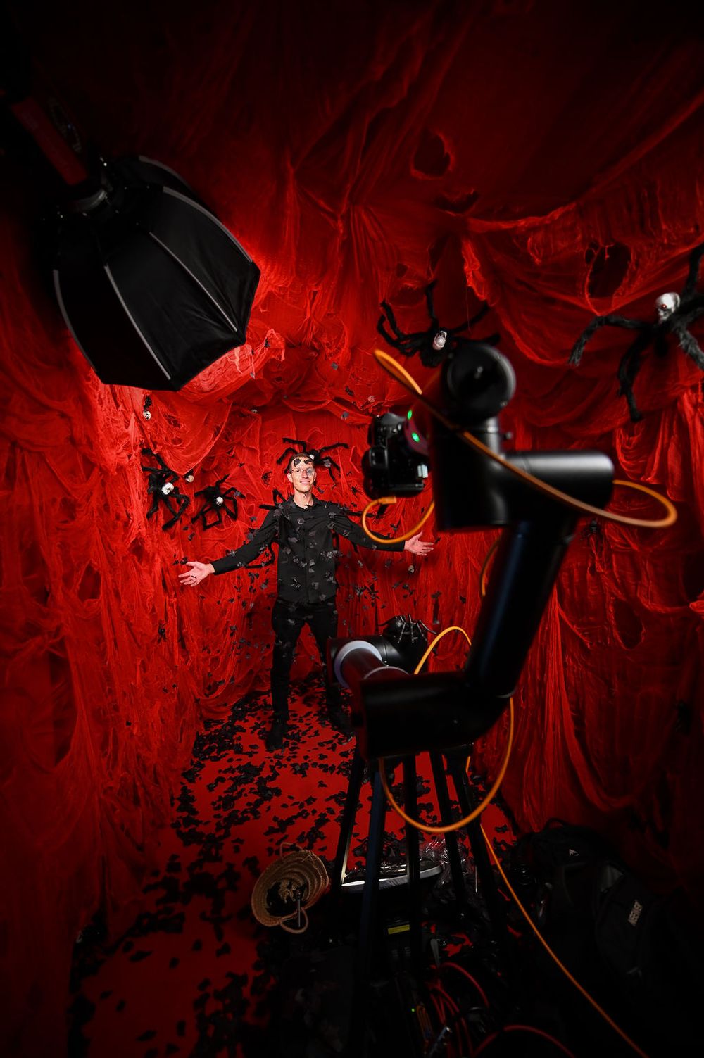 Andrei Oprescu GlamBot with a red Halloween decor with spiders at the YouTube x Lady Gaga Mayhem Halloween Party – La Paloma Barcelona 2025