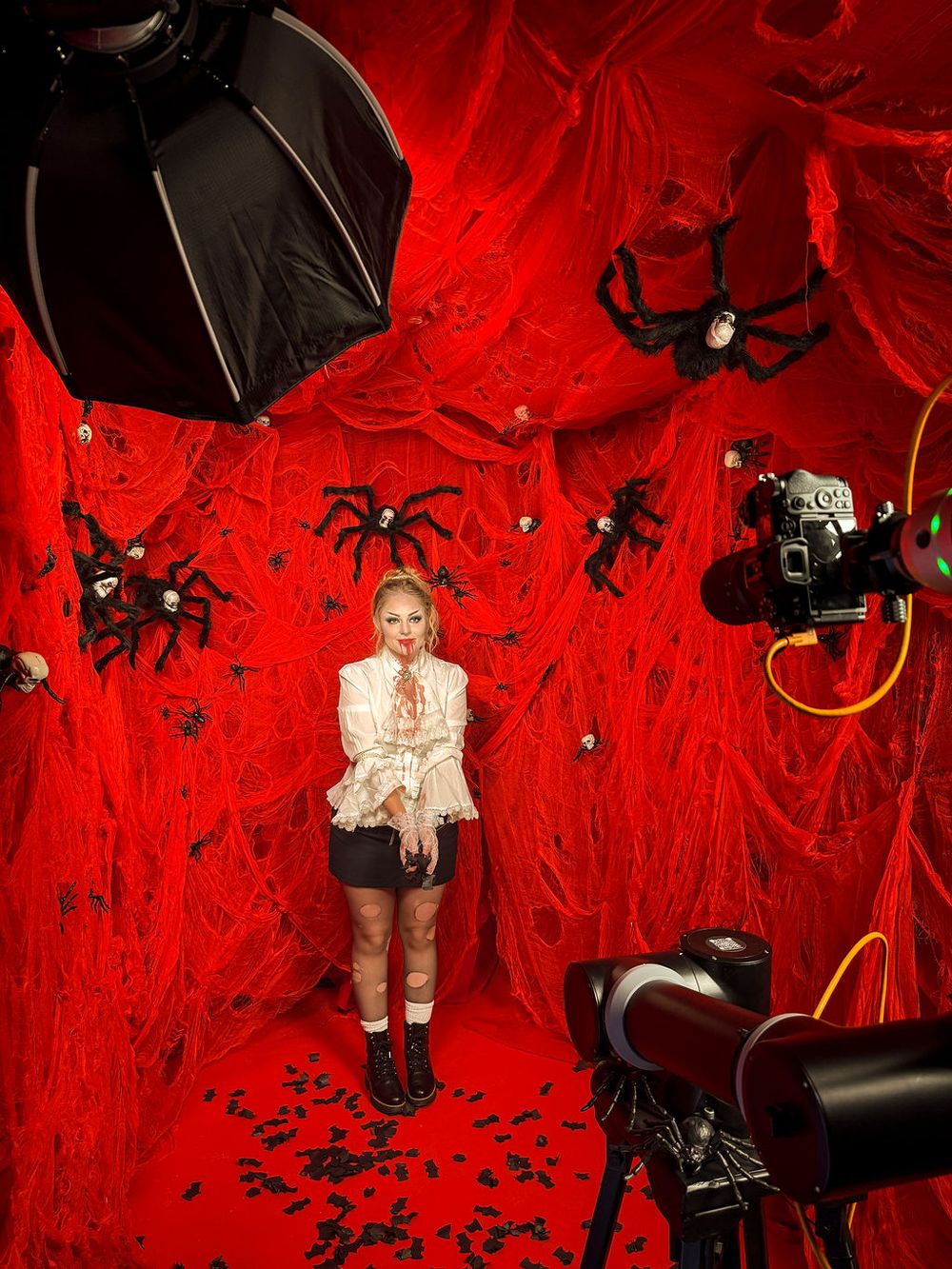 GlamBot with a red Halloween decor with spiders at the YouTube x Lady Gaga Mayhem Halloween Party – La Paloma Barcelona