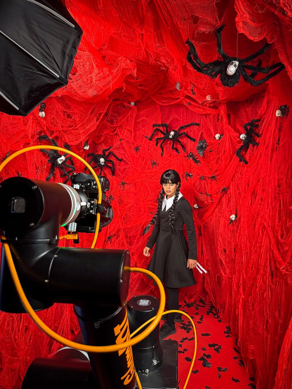 Lorena Parkour GlamBot with a red Halloween decor with spiders at the YouTube x Lady Gaga Mayhem Halloween Party – La Paloma Barcelona
