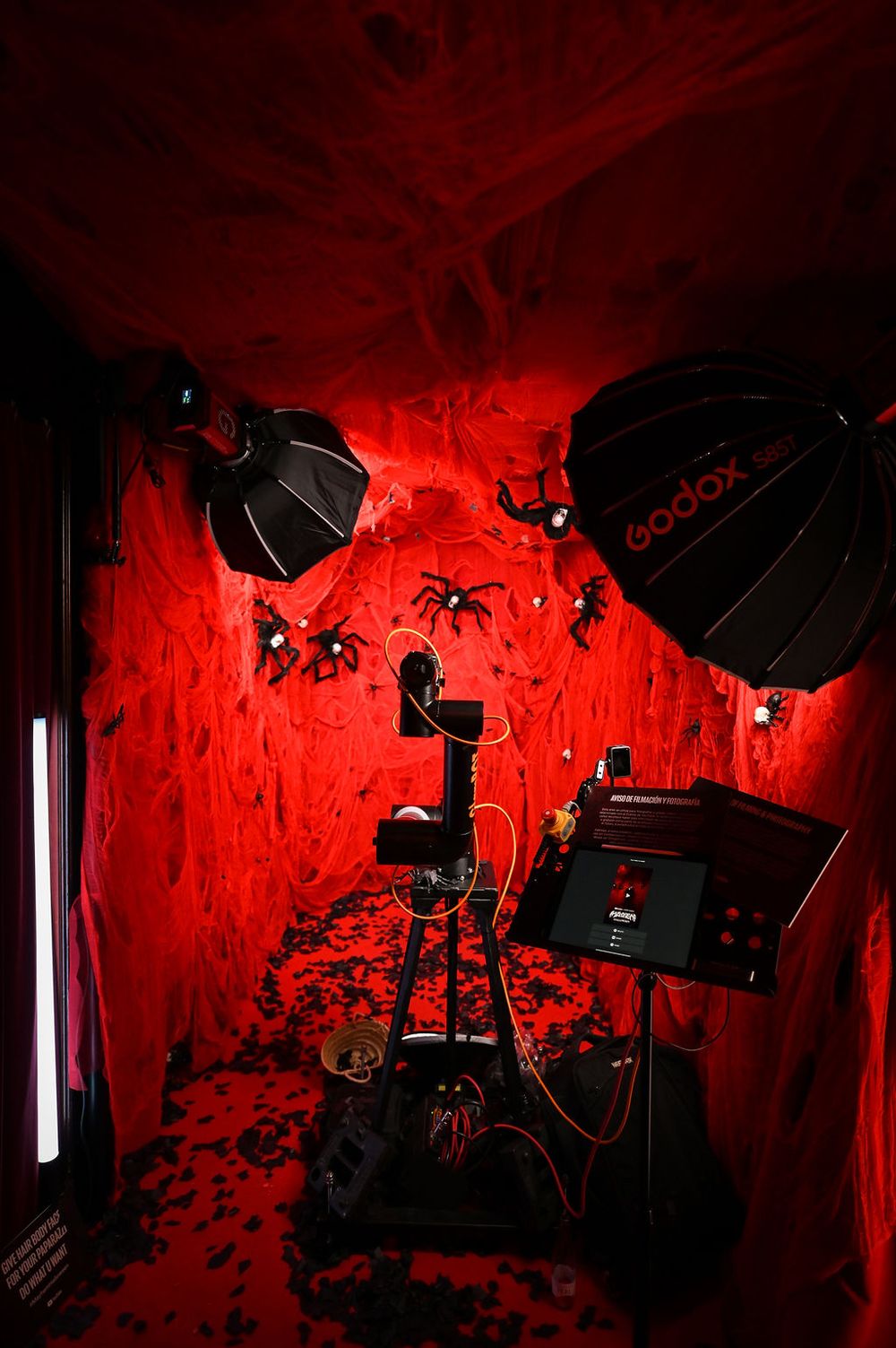 GlamBot with a red Halloween decor with spiders at the YouTube x Lady Gaga Mayhem Halloween Party – La Paloma Barcelona
