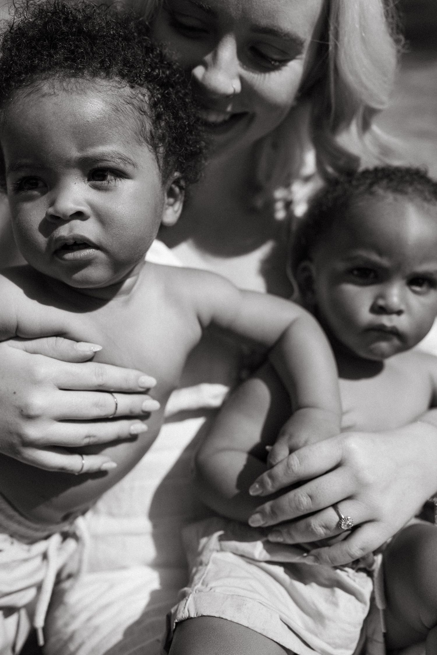 High contrast black and white photographs showing intimate moments and expressions.