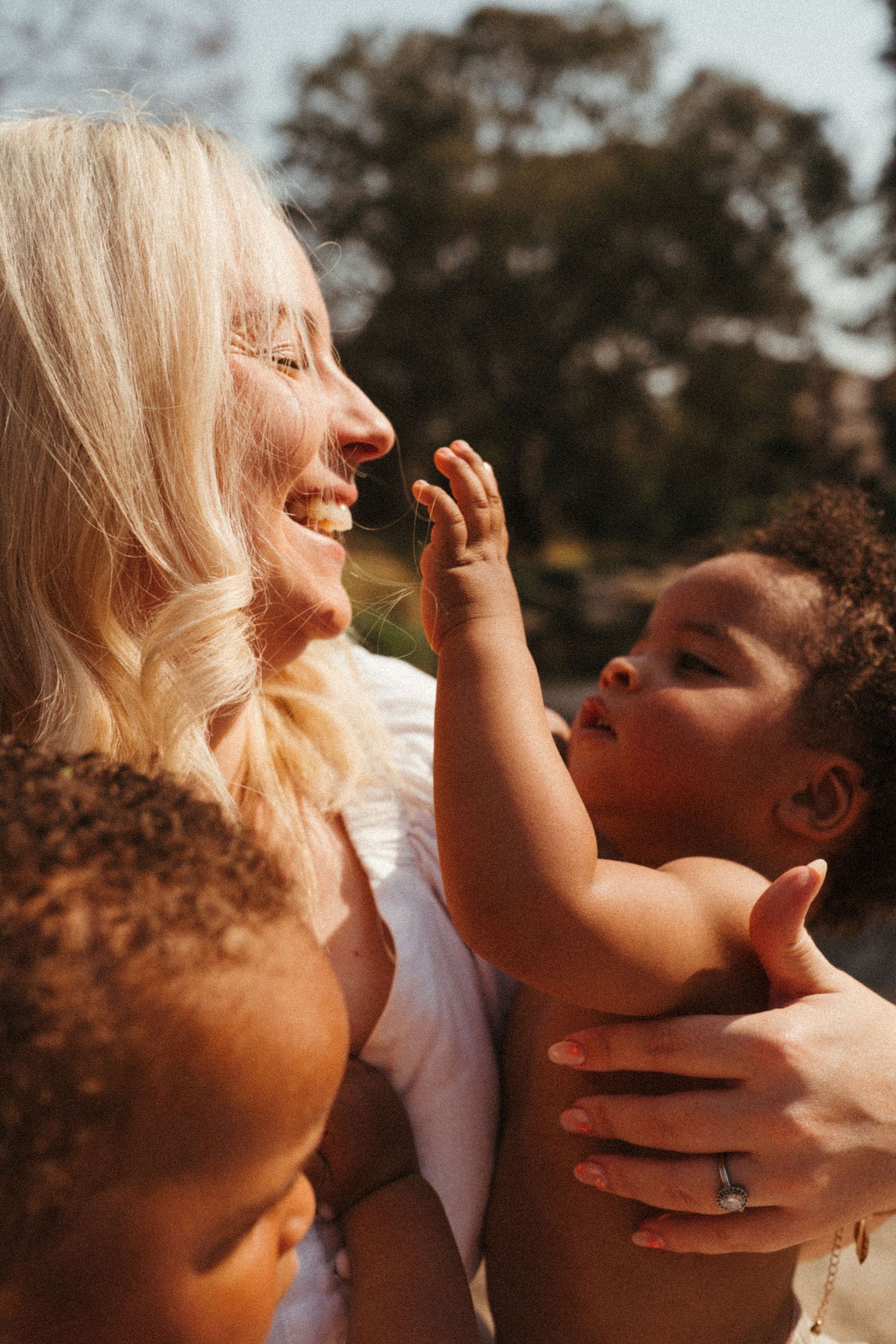 Warm sunset photography session capturing tender moments between subjects.