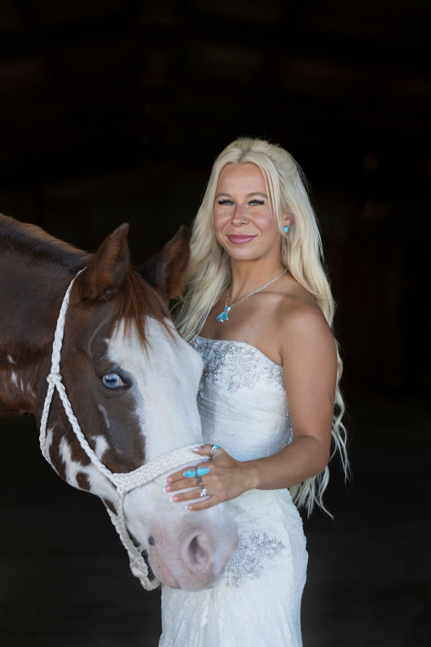 black background bridal portraits with horse