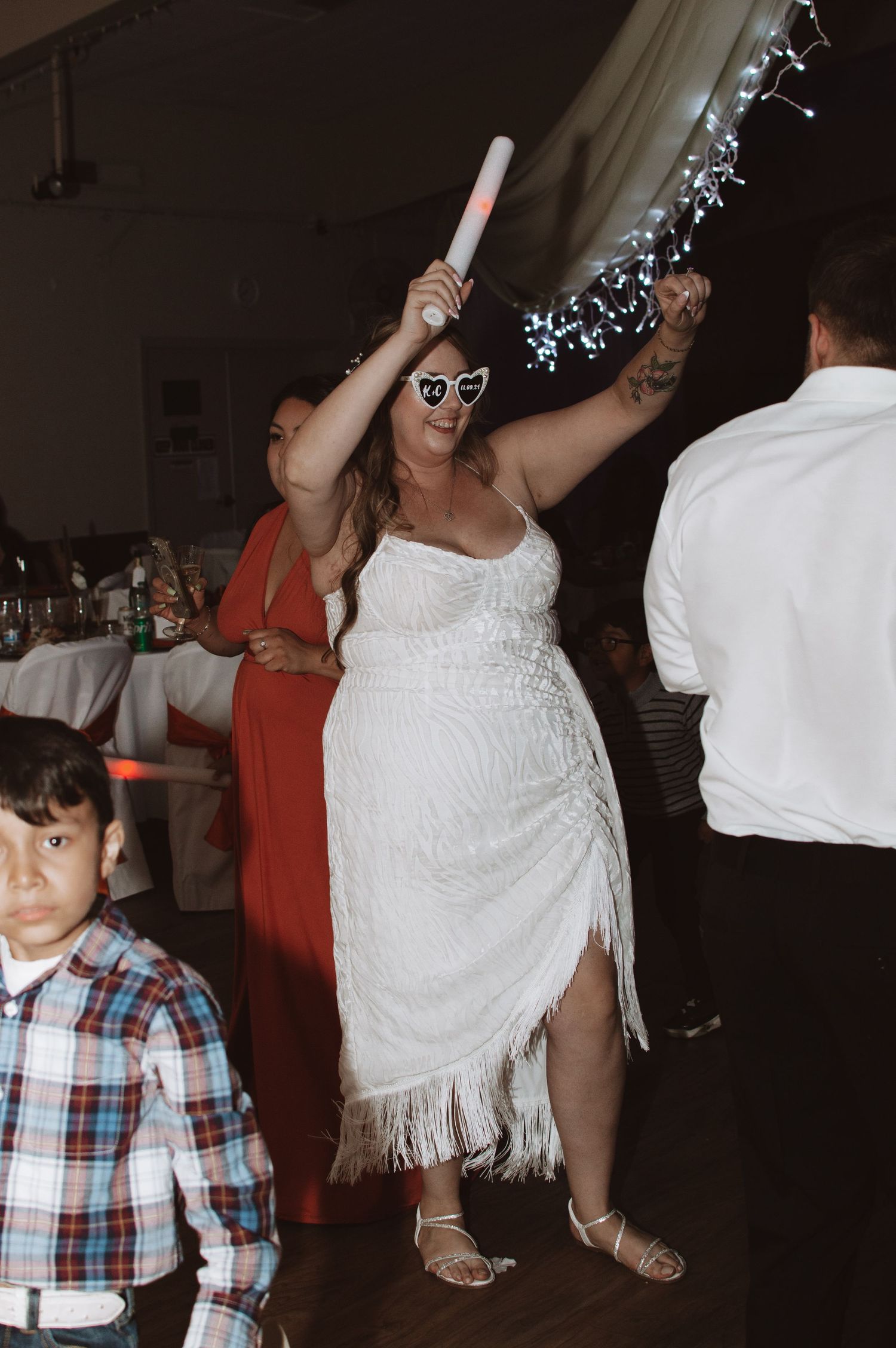 Wedding reception party scene with dancing and celebrations on the dance floor.