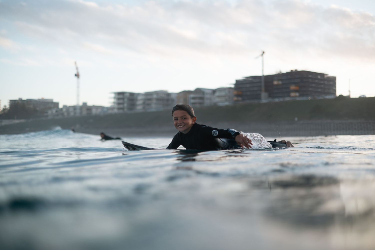 Surfer paddling
