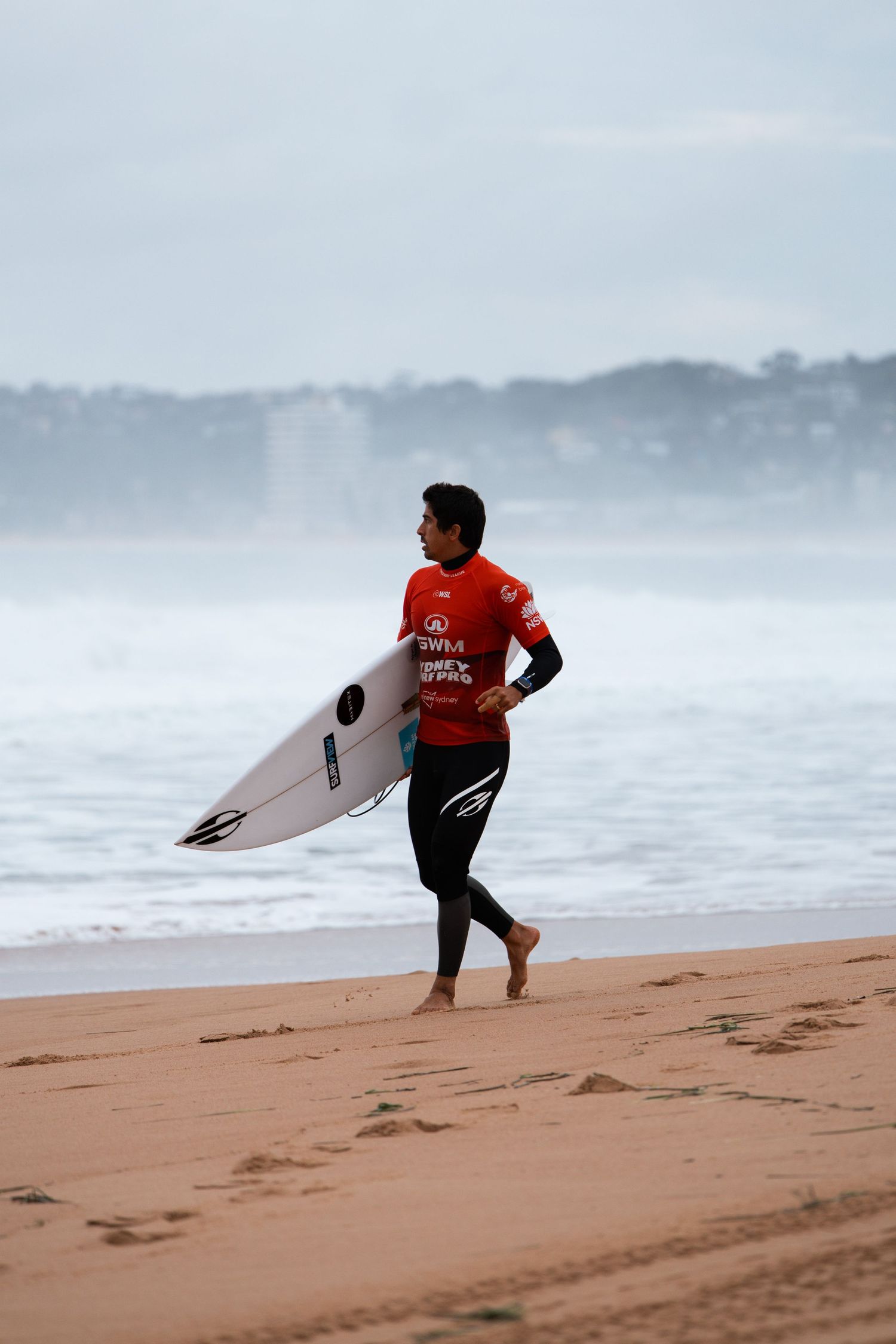 Surfer running