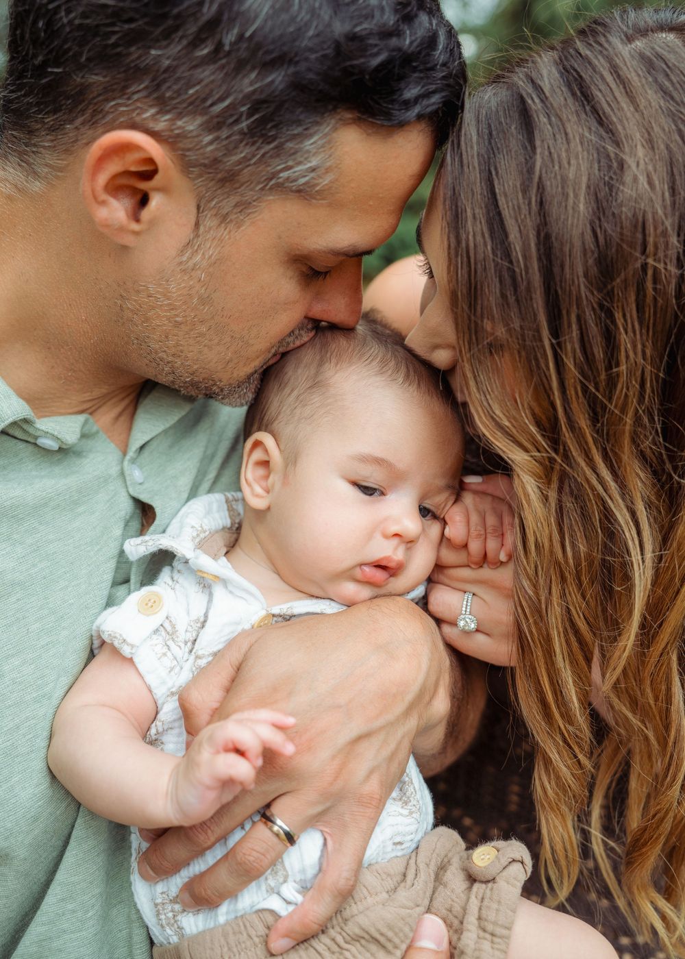 Sweet candid family moments captured in a series of intimate outdoor portraits with natural lighting.