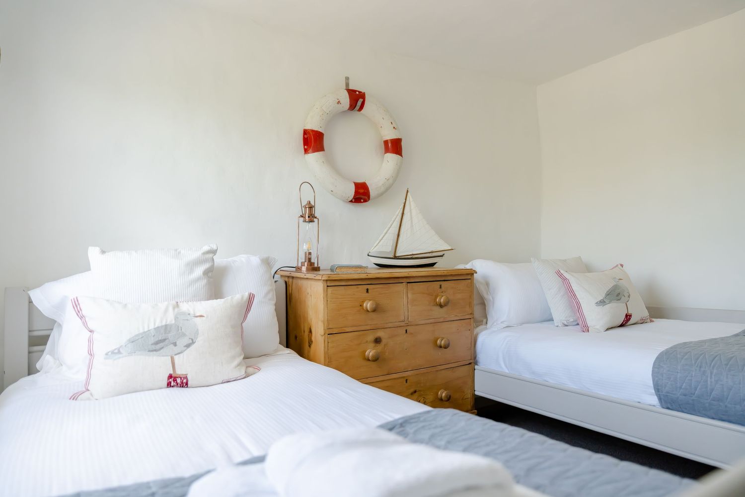 coastal nautical holiday cottage for Airbnb listing neutral twin bedroom
