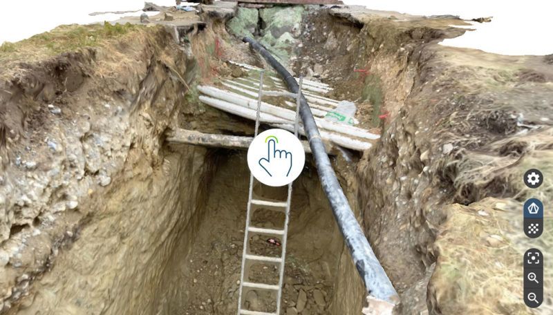 Underground inspection site showing ladder access and utility pipes with interactive marker.