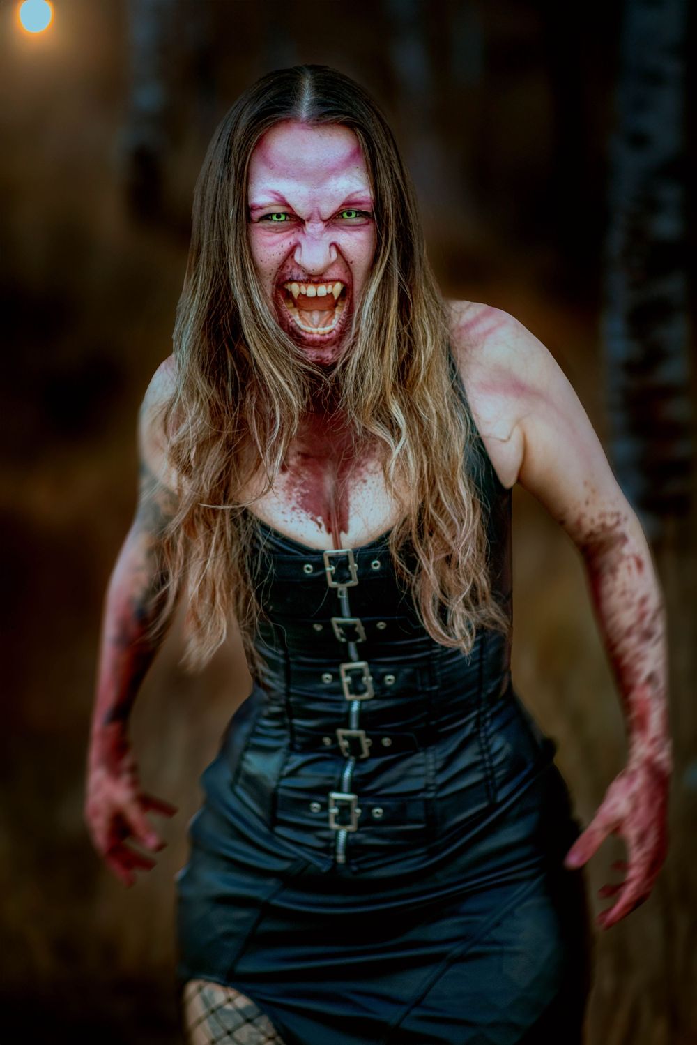 Gothic horror cosplay featuring a dramatic vampire character in a black corset dress.
