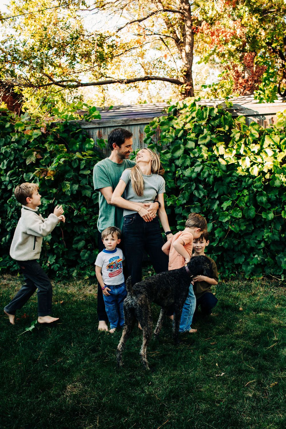 A playful sequence of family moments captured in a backyard garden with autumn foliage in the background.