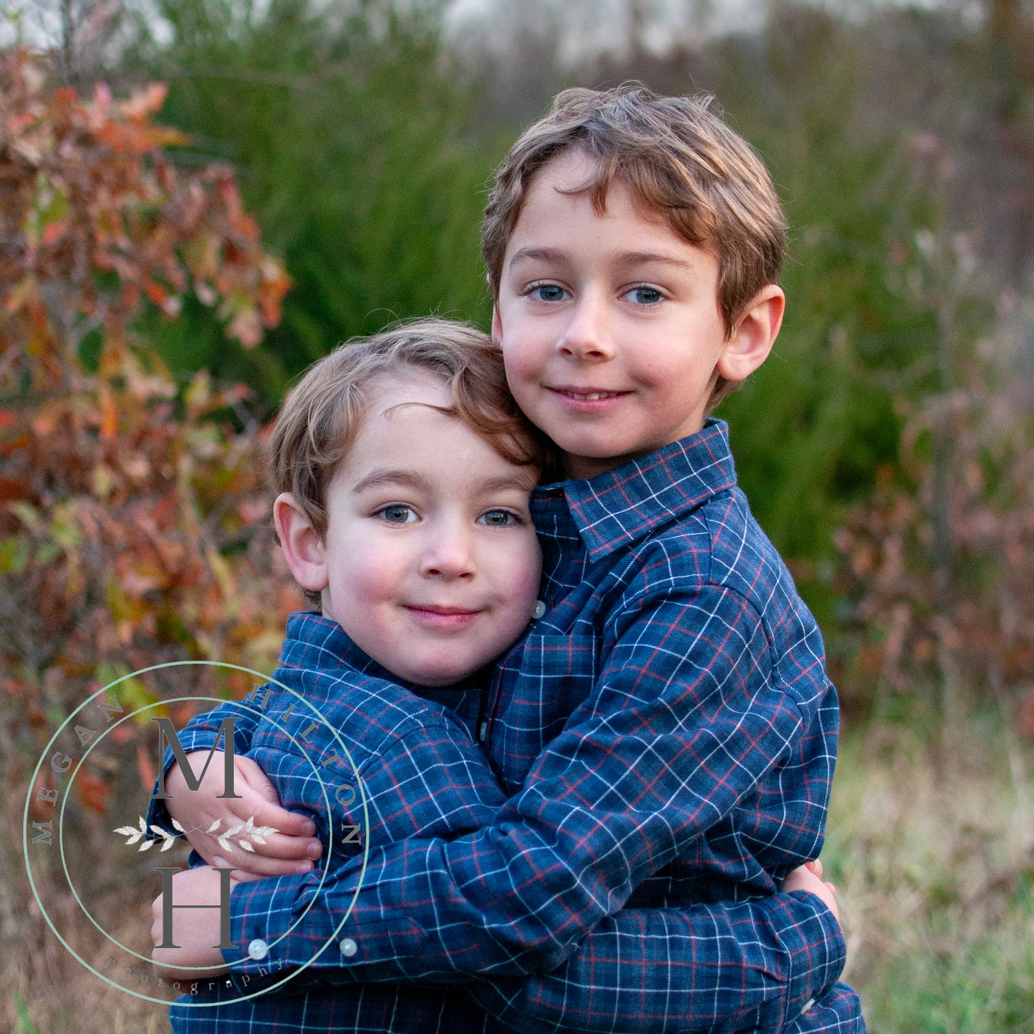 Photo image of two young brothers hugging
