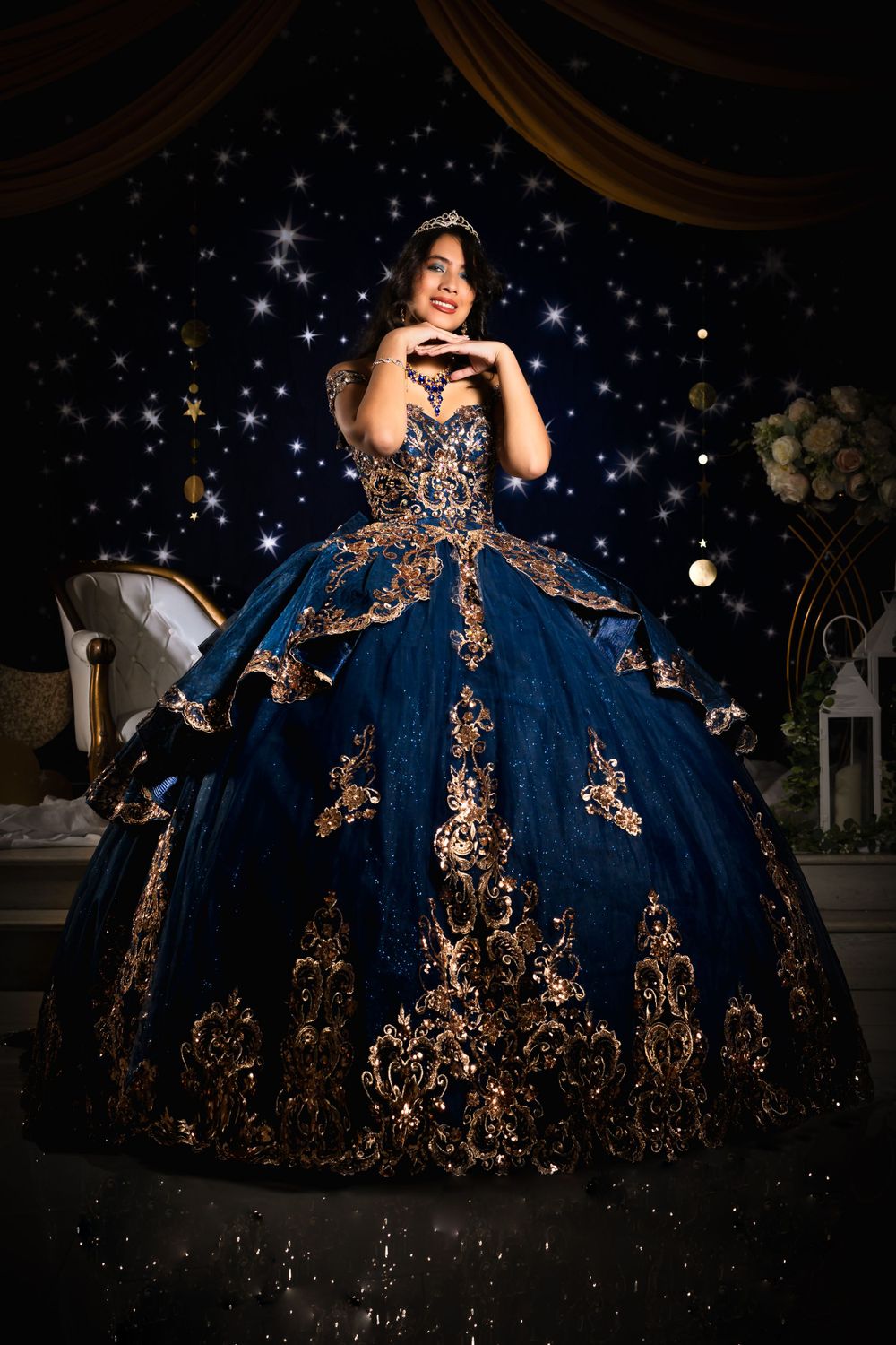 Elegant ball gown with copper embellishments and navy tulle photographed in a celestial setting.