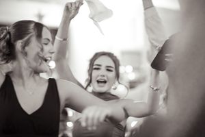 Black and white candid moments from a wedding celebration.