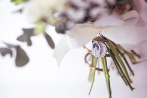 A close-up of delicate pink and white floral arrangements with eucalyptus leaves.