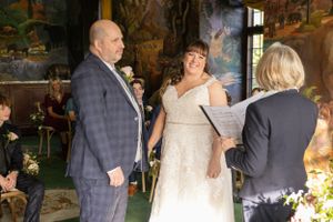 Wedding celebration candid moments in warm indoor lighting.