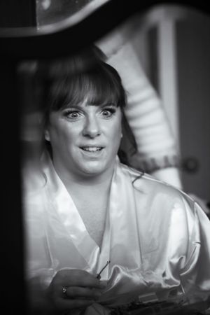 Black and white portrait in soft focus with dramatic lighting.