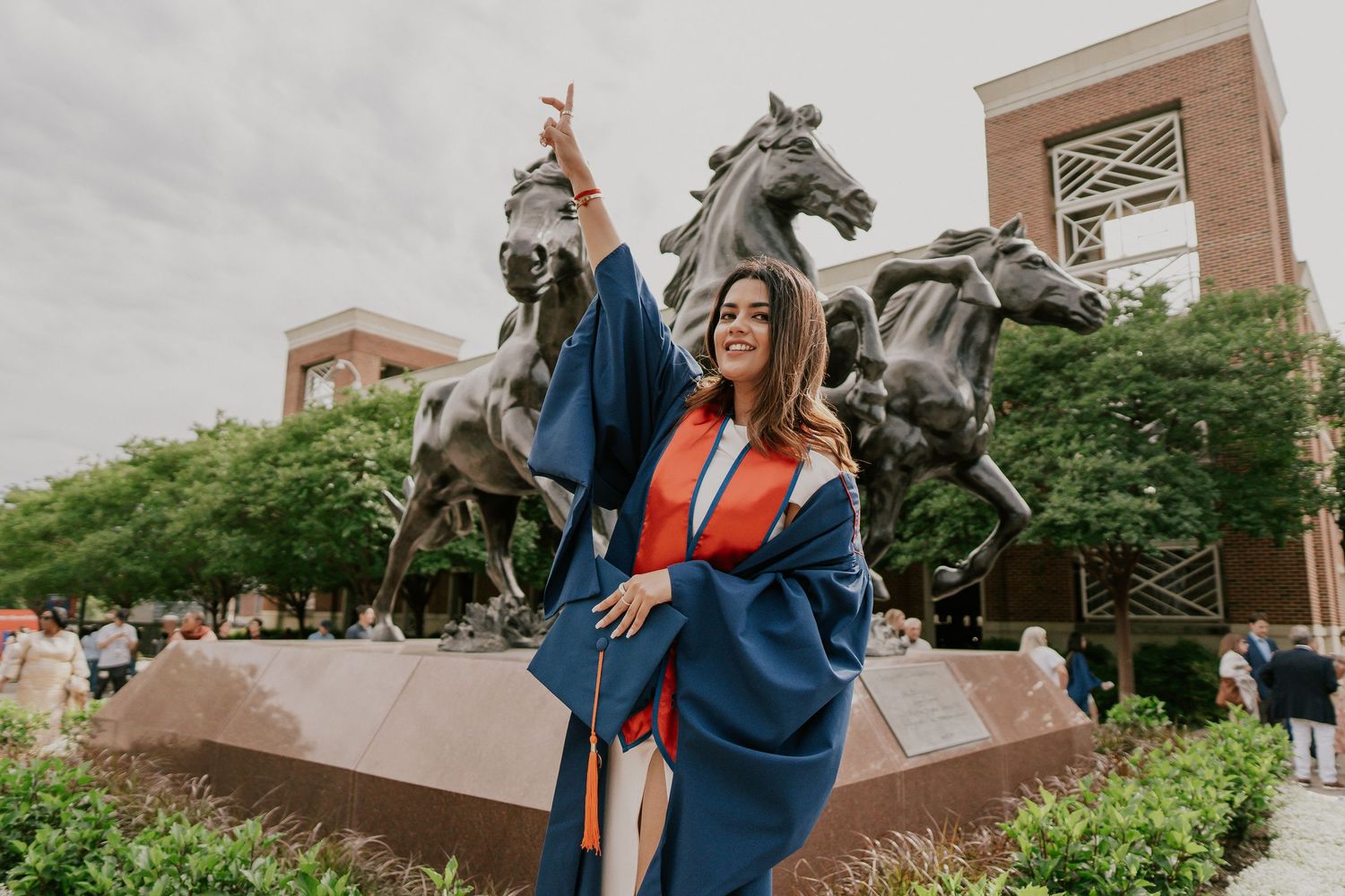 Campus architectural photos featuring brick buildings and equestrian statues.