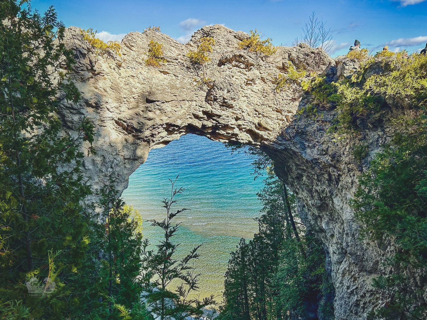 Scenic beach landscape with rocky cliffs and turquoise waters at Chapel Rock at Pictured Rocks National Lakeshore in the Upper Peninsula.