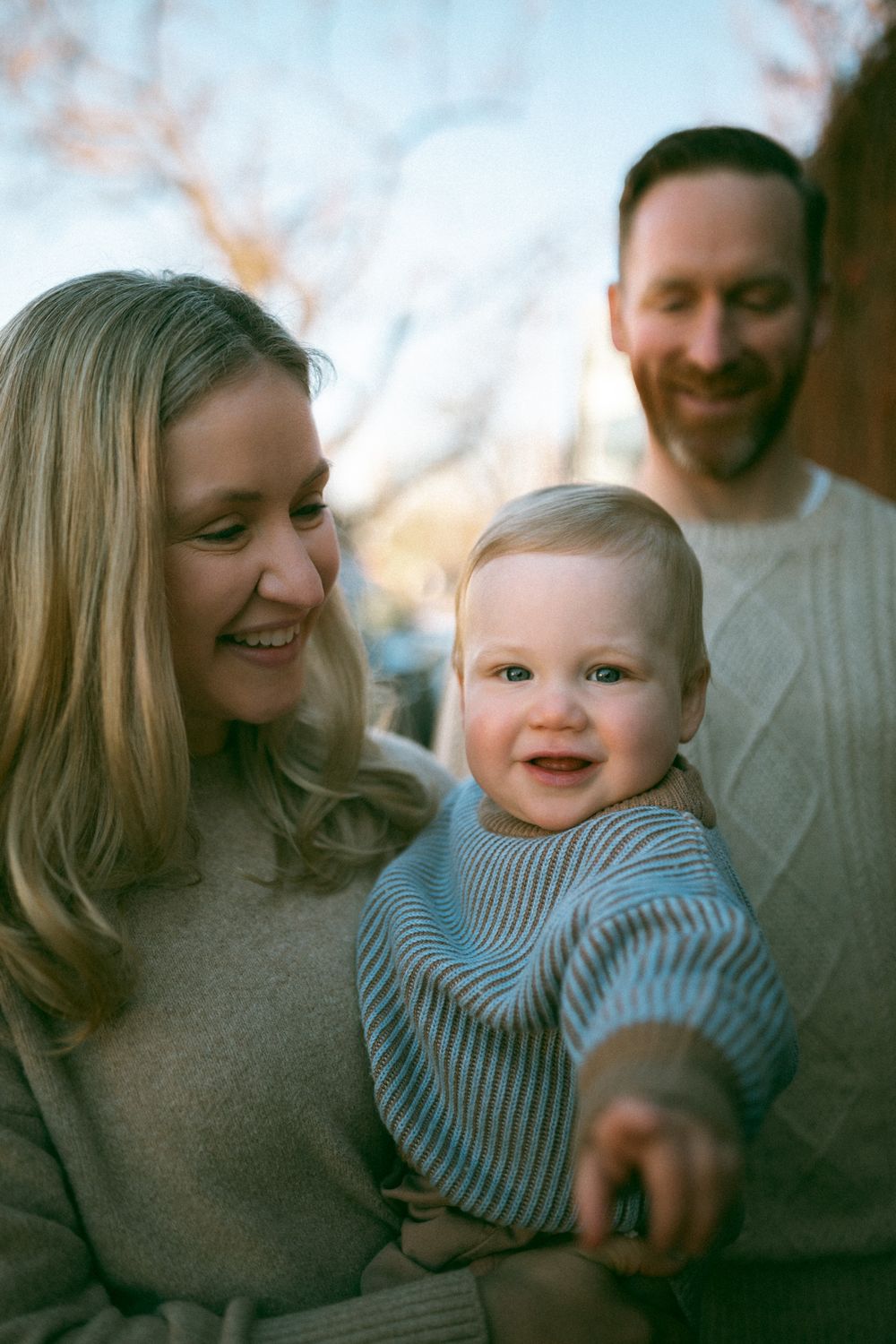 A family shares tender moments together in a series of candid shots showing warmth and joy.